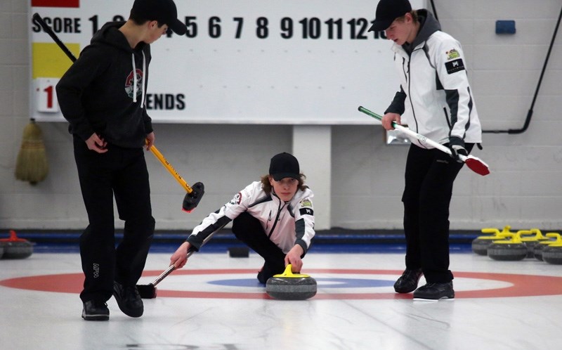 Team Young lead Blake Johnson comes out of the hack with third Quinn Heffron and second Dale McMillan set to sweep at a practice session at the Okotoks Curling Club. The team 