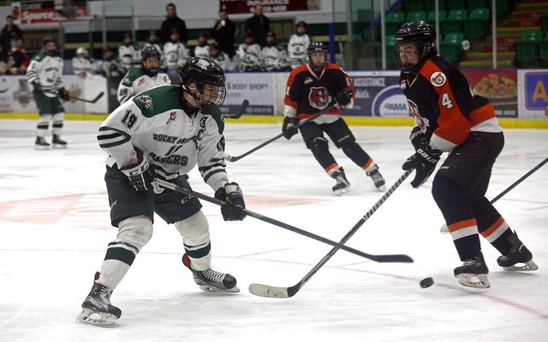 Okotoks&#8217; Peyton Krebs goes around a SEAC defender on Feb. 13. Krebs potted six points to reach the 100-point mark with the Rocky Mountain Bantam AAA Raiders.
