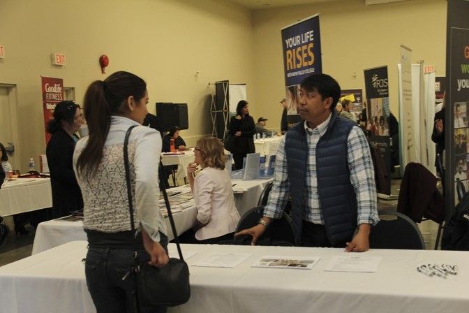 Jonathon Corsino, human resources generalist at Cargill, speaks with a potential applicant during the Career and Employment Expo in Okotoks on March 3.