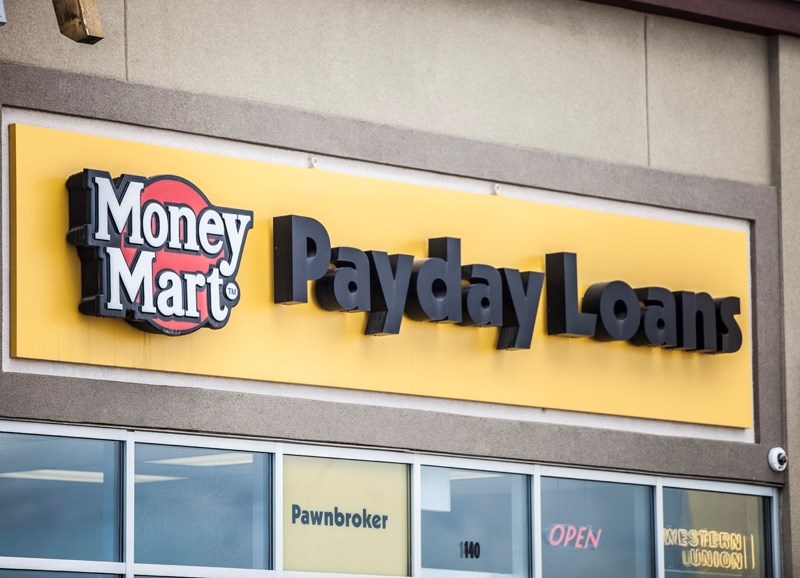 The Provincial government is looking to tighten rules for payday loan companies, such as the Money Mart in Okotoks pictured above.
