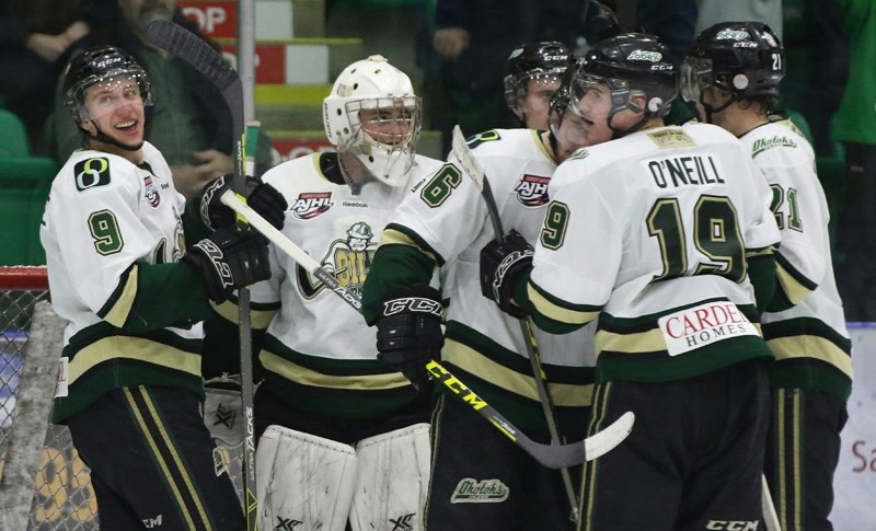 The Okotoks Oilers celebrate after beating the Camrose Kodiaks 2-1 in Game 4 of the AJHL South semifinal series March 24 at Pason Centennial Arena.