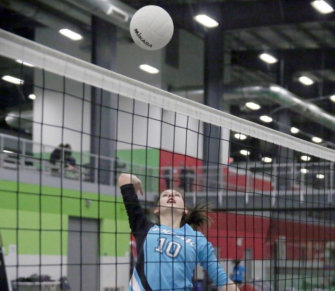 Claire Sweeney of the Peak Volleyball U13(A) team goes up for a spike during a drill at the Crescent Point Field House near Aldersyde. Peak is hosting a tournament April 9-10 
