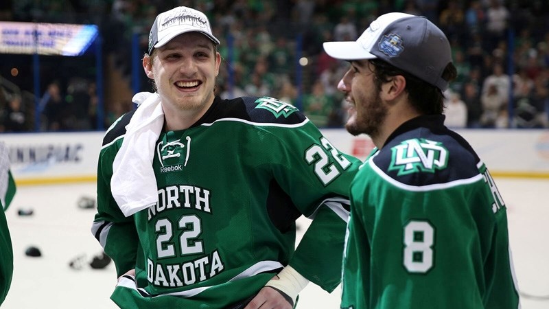 North Dakota&#8217;s Rhett Gardner, left, celebrates with teammate Nick Schmaltz after winning the Frozen Four NCAA Division I Men&#8217;s Hockey Championships in a 5-1