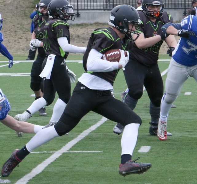Big Rock Bengal Blake Klotz rushes up the field during Big Rock&#8217; s 36-14 loss to the Calgary Colts on April 14.