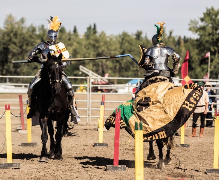 Society of Tilt and Lance Cavalry jouster Dale Thwaites lances fellow knight and society founder Radar Goddard at the Millarville and Priddis Fair on Aug. 21. One of the few