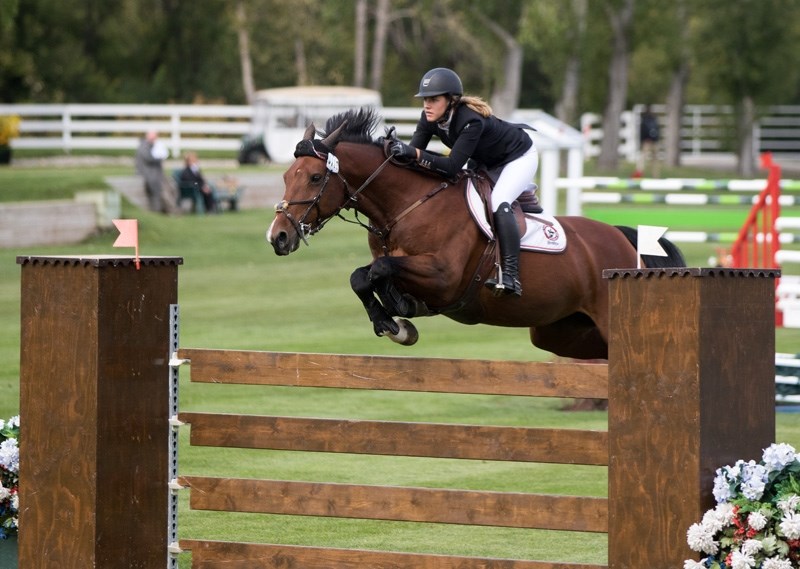 DeWinton&#8217; s Tayah Sobie and her horse Tamara leap an obstacle at the Spruce Meadows Masters on Sept. 8. Sobie and her horse Catalina won two events at the Masters.
