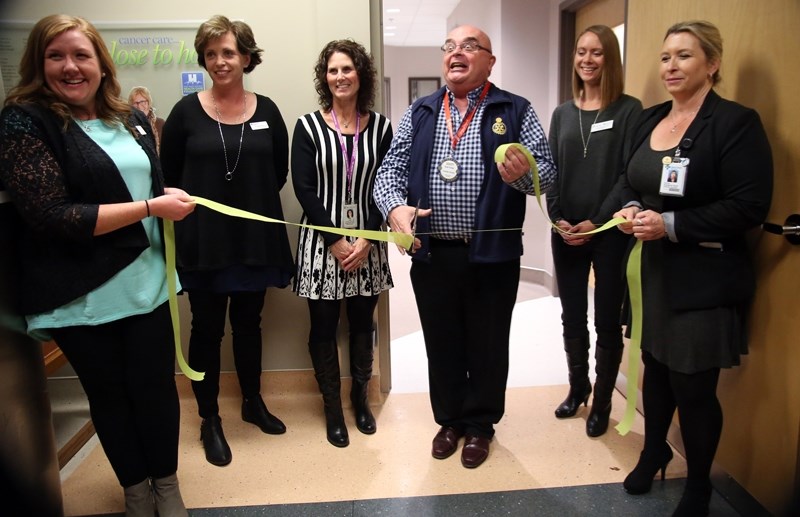 The new $1.6-million High River Community Cancer Centre at High River Hospital officially opened on Sept. 23 with the cutting of the ribbon by patient Scott Forbes. Helping