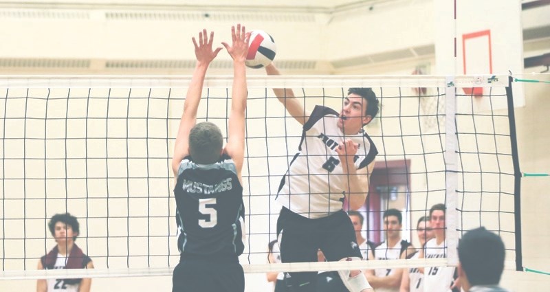 Foothills Falcon Tate Morrell rises for a spike last season against Highwood. The Falcons will have new local competition in the 4A boys volleyball ranks with the Holy