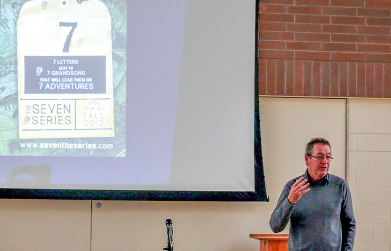 Award-winning young adult novelist Eric Walters speaks to parents and students a St. John Paul II Collegiate on Sept. 28.