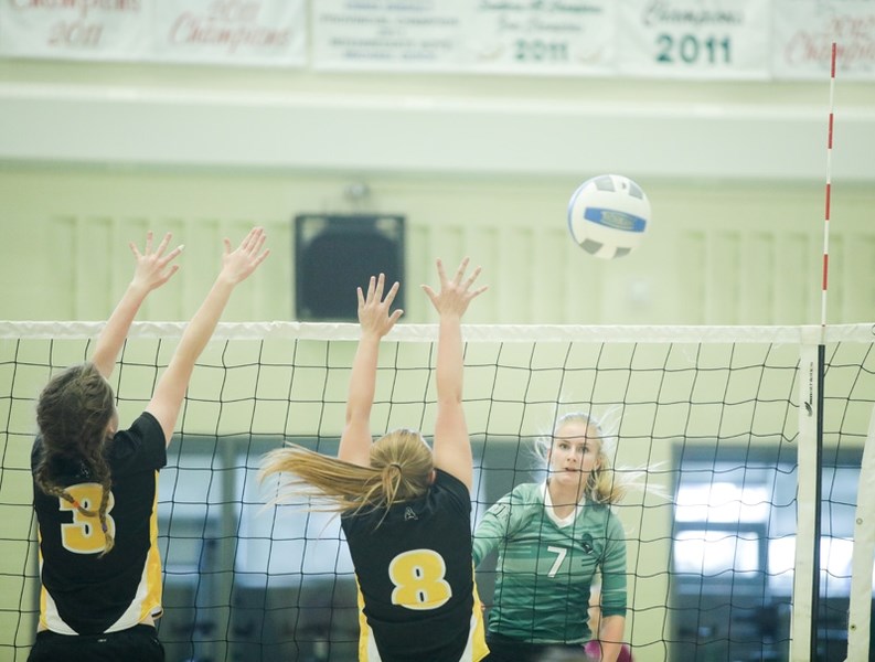 Annelise Hielema of the Holy Trinity Academy Knights hits a spike over the Oilfields Drillers at HTA on Sept. 28.