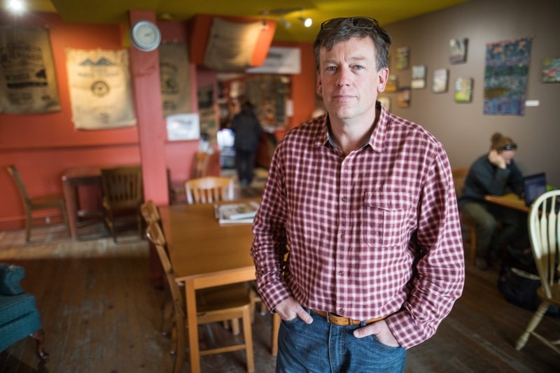 Mike Kingston, owner of The Stop Coffee House and Gathering Place in Black Diamond, is concerned about the impact a higher minimum wage will have on small businesses.