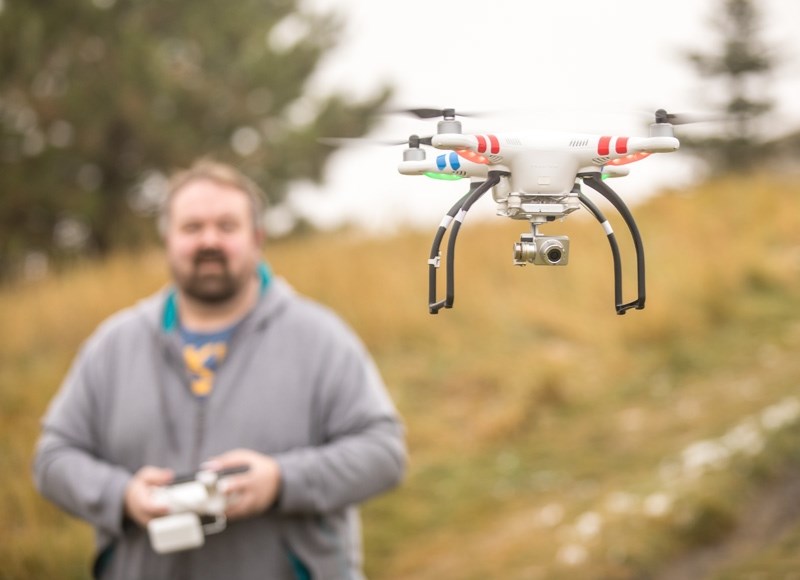 Bryce Schutte flies his DJI Phantom drone for fun in a park on Oct. 8. While Schutte says he plays by the rules, some drone use in rural areas has concerned residents.