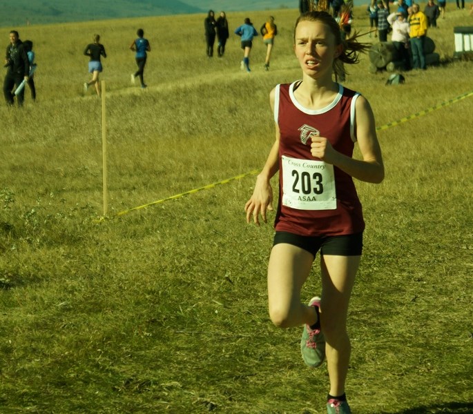 Foothills Falcon Rosie Bouchard finds her pace in finishing third in the Junior girls 3,000m at the Alberta Schools&#8217; Athletic Association cross-country championships