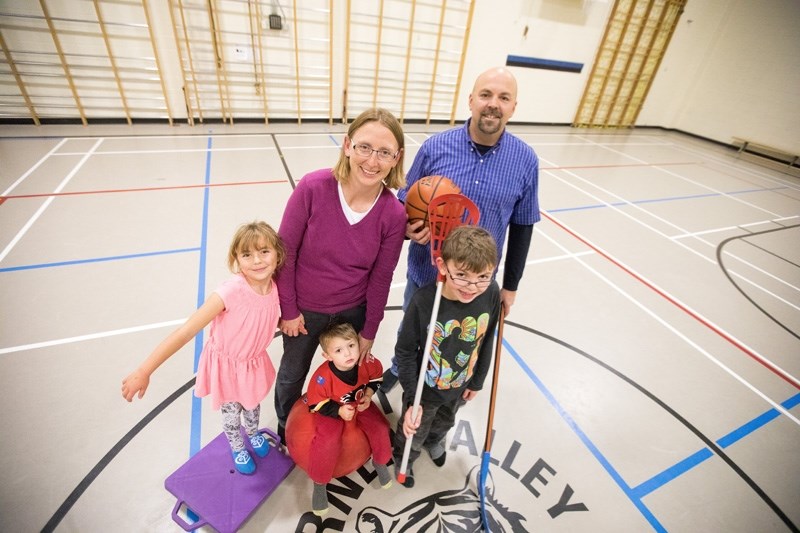 Tracie and Cameron David, with their kids (left to right) Jamie, Johnathan, and Jason in the Turner Valley School gym on Oct. 17.