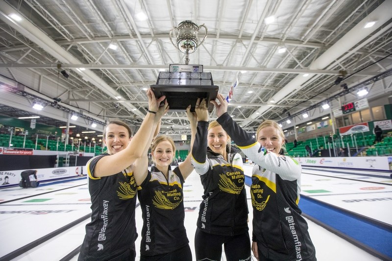 Team Flaxey holds the Grand Slam of Curling trophy aloft after taking the title in a tense 6-3 victory over Team Homan at the WFG Masters women&#8217;s final at Pason