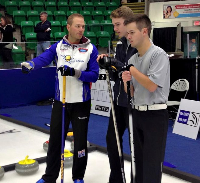 Geoff Walker from Team Gushue discusses strategy with Team Knopp&#8217; s skip Cailen Knopp and the third Michael Steele on Oct. 30 at the Rock Stars for Curling at the Pason 
