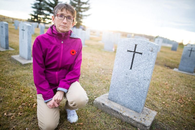 Karen Peters in the Okotoks Cemetery on Nov. 7. Peters will lead a tour highlighting the history of Okotoks&#8217; fallen soldiers on Nov. 11 at 2 p.m. in the cemetery.