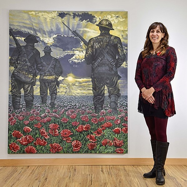 Longview painter Deanna Lavoie (Sinton) stands beside her six-by-five-foot acrylic First World War commemorative painting The Journey to Remembrance at Prairie Studio Images
