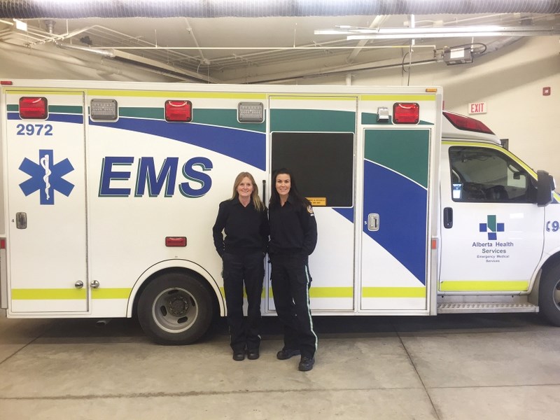 Virdell Barclay, left, with 16-year EMT partner Janeil McFarlane on her last day of work with Okotoks emergency medical services. Barclay was born in High River and worked as 