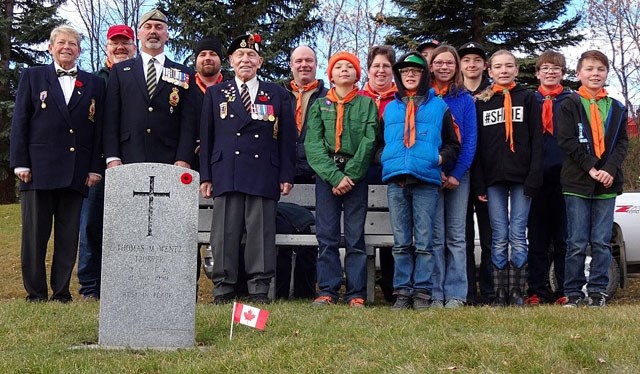 Members of the Royal Canadian Legion Turner Valley Branch and the Oilfields First Scouts group placed poppies and Canadian flags at the headstones of veterans in the