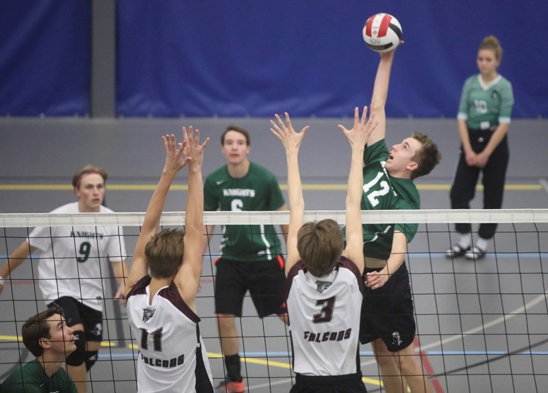 Holy Trinity Academy Knight Cole Fieseler stretches out for a big hit versus the Foothills Falcons during the Foothills Athletic Council senior boys volleyball championship,