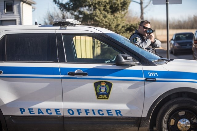 A peace officer does radar traffic enforcement. OkotoksToday.ca/File