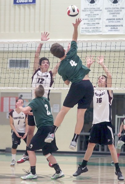 Holy Trinity Academy Knight Isaiah Michel rises for a big hit versus the Foothills Falcons in Game 2 of the 4A Boys Volleyball South Central Zone final, Nov. 17 at HTA. The