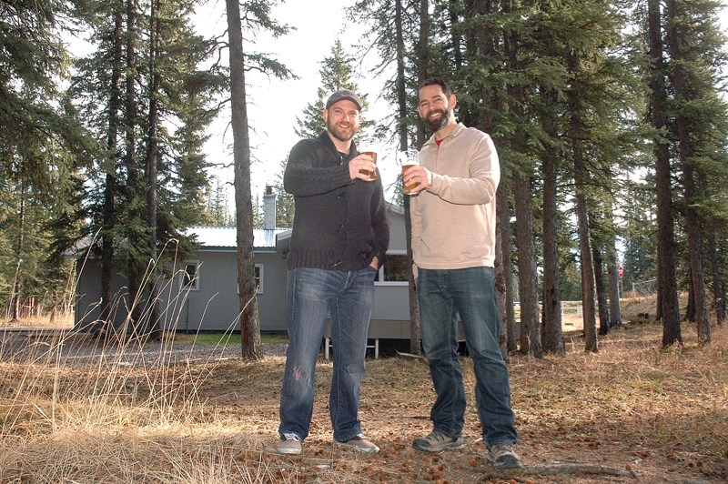 Kirk Bodnar, left, and Baruch Laskin raise a glass to their plans to build a craft brewery and restaurant in Bragg Creek along with fellow business partner Adam McLane (not