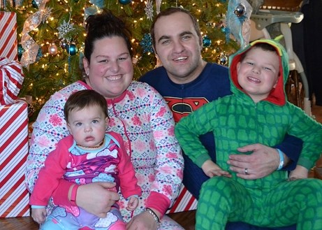 Mandy Janicki, pictured with husband Andy and children Brooklyn and Dylan, had a seizure that resulted in severe brain damage. Her friends are hosting Christmas for the