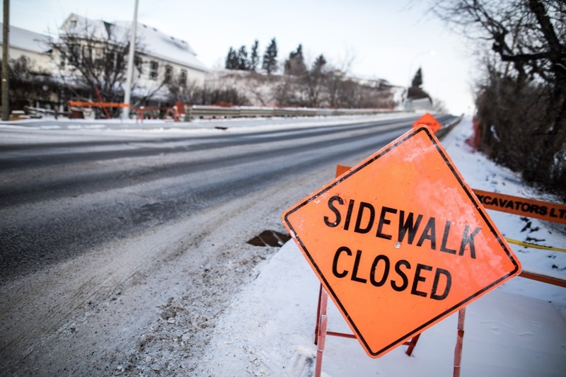 Barricades block the sidewalk on Dec. 6 as the east sidewalk of Veterans Way remains closed into the winter.