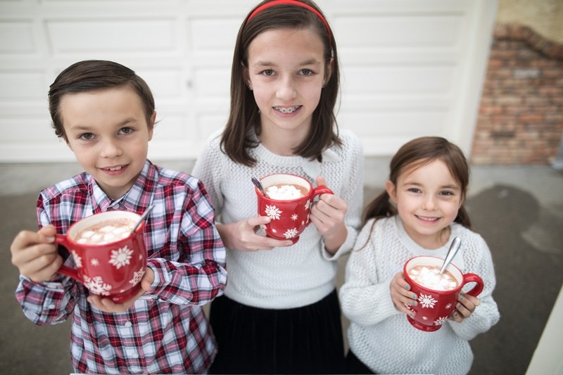 From left, Will, Bella and Lily Chapman show off the hot chocolate they&#8217;ll be giving away in exchange for food bank items at Sobeys from 11 a.m. to 4 p.m. on Dec. 10.