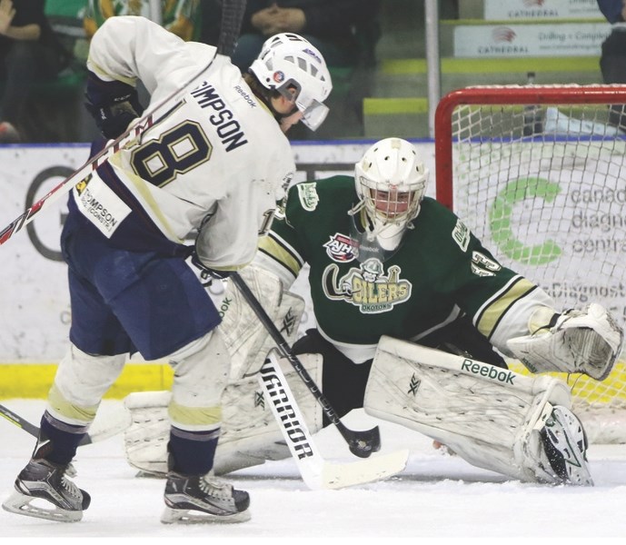 Okotoks Oilers goaltenders Riley Morris, left, and Matthew Armitage, right, have been invaluable on the last line of defence for the Alberta Junior Hockey League team.