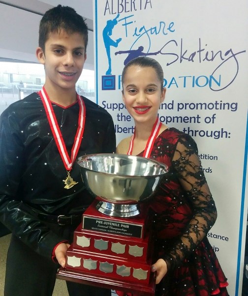 Luke and Charlotte Arbib with the pre-junvenile pairs freeskate trophy they won at the Alberta/NWT/Nunavut sectional championships in Edmonton Nov. 3-6.