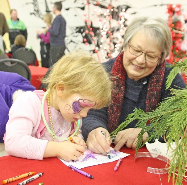 Rita Ferguson helps granddaughter Emelina Snelling colour at last year&#8217; s New Year&#8217; s Eve festivities. This year&#8217; s event takes place Dec. 31 from 5 p.m. to 