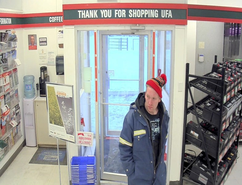 High River RCMP allege surveillance shows the two males (one in picture) at the High River UFA store walked in and put several items in their pockets before leaving the store.