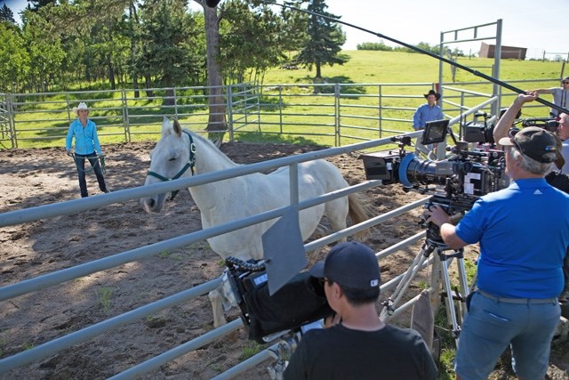 The crew of Heartland films a scene during season 10 featuring lead actress Amber Marshall, left. Items used on the show are up for auction until the end of March.
