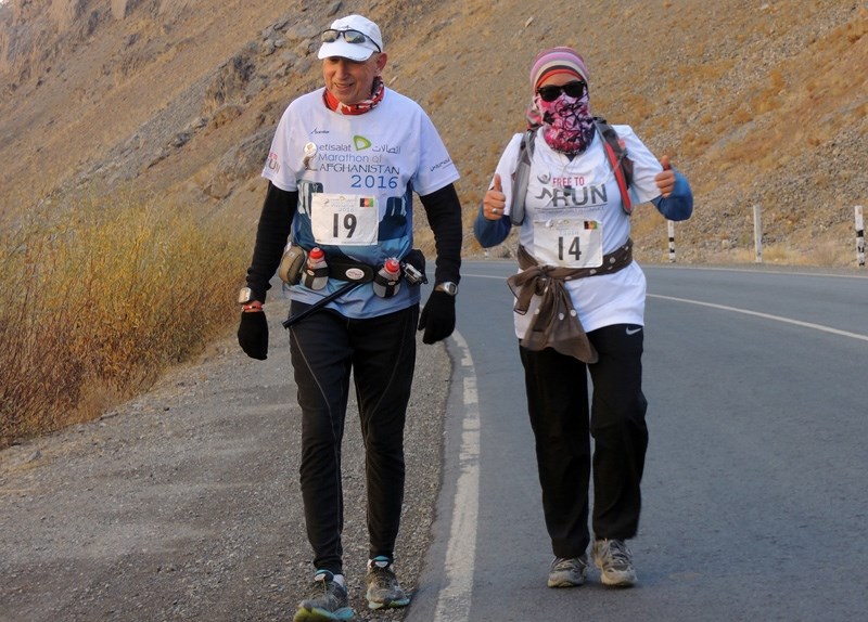 Martin Parnell, left, on the path of the Marathon Afghanistan in Bamyan last November. He is joined by Afghani woman Kubra Jafari. Parnell is a guest speaker at the Okotoks