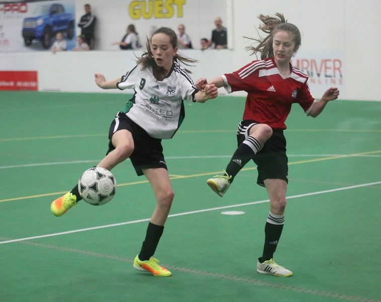 Okotoks United&#8217; s Cadence Laplante stretches out to take a shot versus West Hills in U14 action during the United Communities Cup, Jan. 22 at Crescent Point Field House.