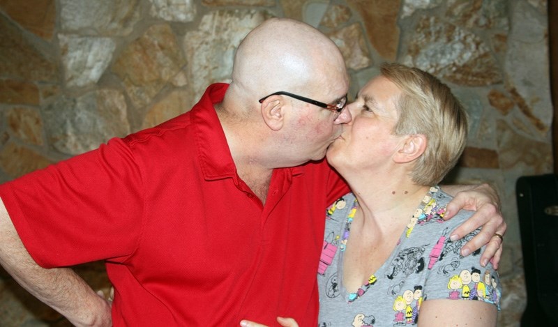 Grant Sullivan and Silvia Corsini enjoy a pre-Valentine&#8217;s Day kiss on Feb. 5. Silvia donated a kidney to her husband of more than 30 years last September
