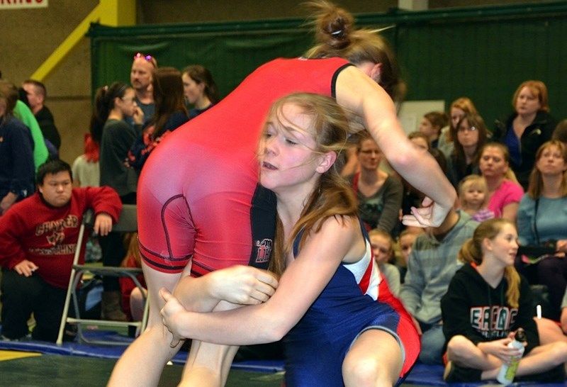 Sadie Watkins, here wrestling at a meet in December, has won back to back gold medals at 61kg in meets in Forest Lawn and Sir Winston Churchill High School respectively.