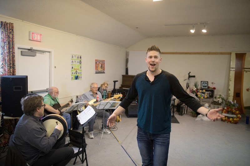 Lafferty, played by Hayden Ryan, sings of his own funeral during a rehearsal of Dewdney Players&#8217; rendition of Lafferty&#8217;s Wake at the Aldersyde Community Hall on