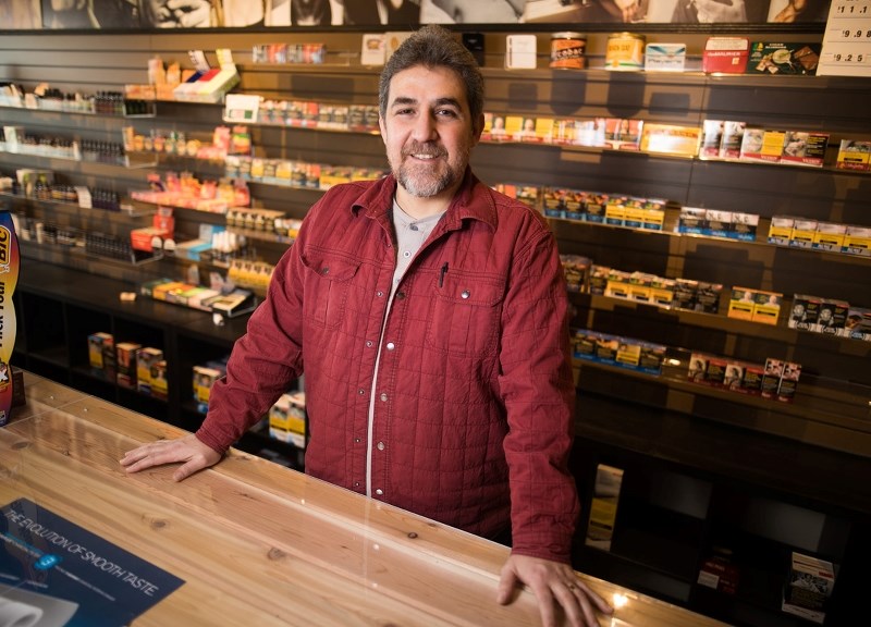Alejandro Cuellar Diaz Ceballo in his store, Cheap Smokes and Cigars, on Feb. 21. Ceballo says Biz Link workshops and bootcamps are an inspiration for his business.
