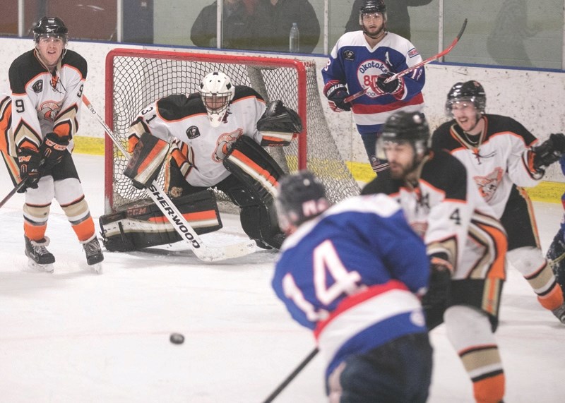 Okotoks Bisons defence Jaret Bordt takes a shot on the Coaldale Copperheads goal during game 7 against the Copperheads on Feb. 26.