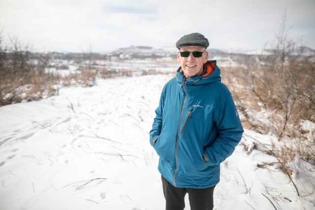 Rod Mumby, the project leader for the Jack Bowman Interpretive Trail, stands at one of the sites that will be part of the trail overlooking the Turner Valley Gas Plant.