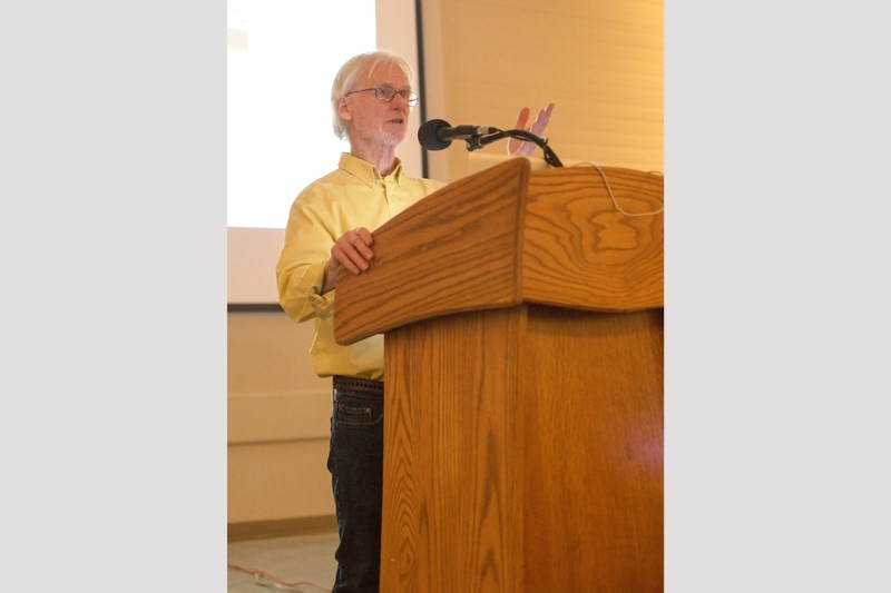 Rob Harlan of the Solar Energy Society of Alberta speaks at the Okotoks Foothills Centennial Centre on March 23.