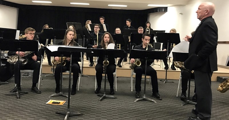 Holy Trinity Academy music instructor Tom Taylor gets set to direct the Grade 11 Jazz band prior to their gold standard performance at the Alberta International Band Festival 