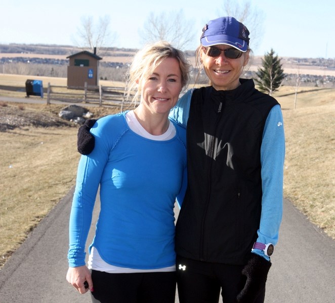 Okotoks runners Niki Doyle, left, and Lori Toombs both ran the famed Boston Marathon in less than four hours on April 17.