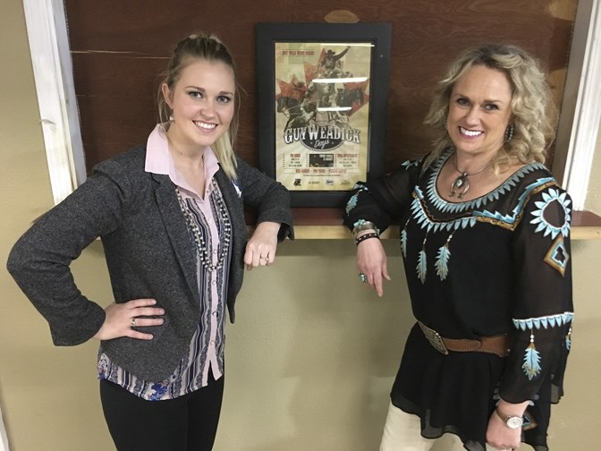 Trish Seitz, right, and Gillian Grant, C5 Rodeo Coordinator in front of the 2017 Guy Weadick Days poster.