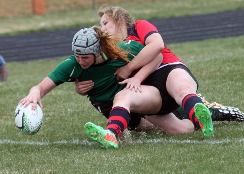 Okotoks resident Rylee Stone, here scoring a try for the Holy Trinity Academy Knights, has committed to play in the NCAA for the Dartmouth College Big Green in the fall.