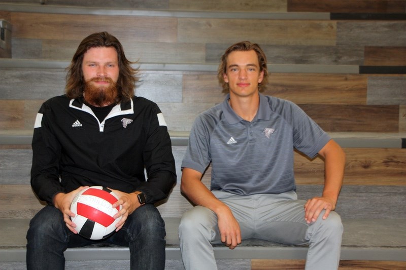 Former Foothills Falcon players Matt Armstrong, left, and Brett Carter are now coaching the senior boys volleyball squad at their alma mater.